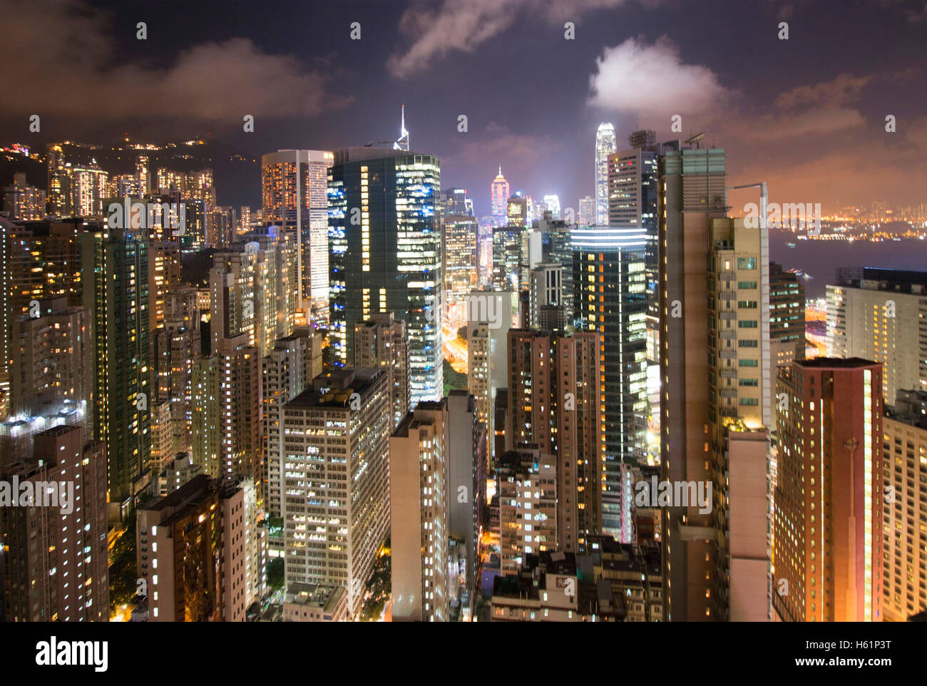 Skyscrapers business center of Hong Kong Island Wan Chai China Asia seen from rooftop terrace by night. Stock Photo