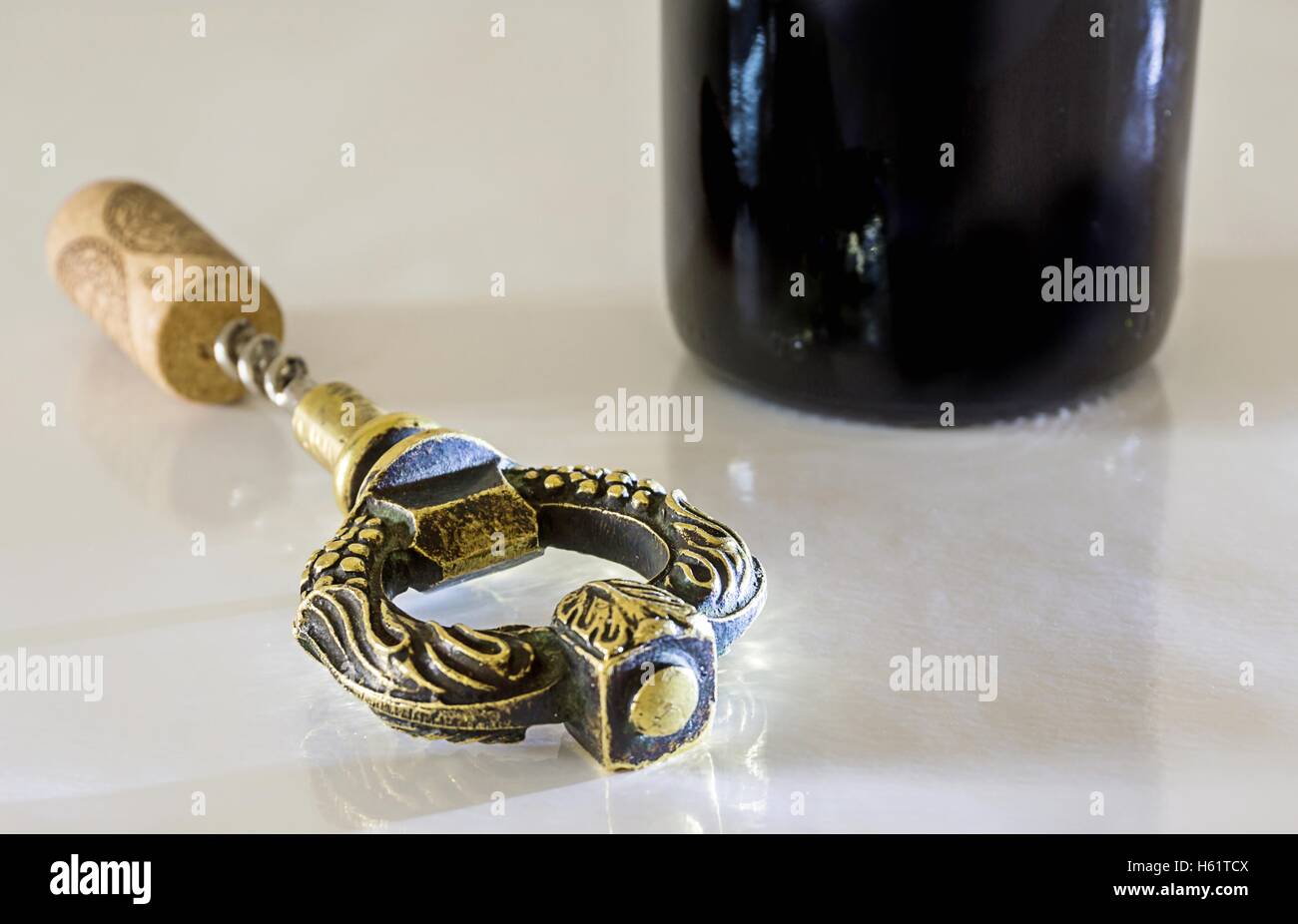 Corkscrew by the bottle of red wine Stock Photo