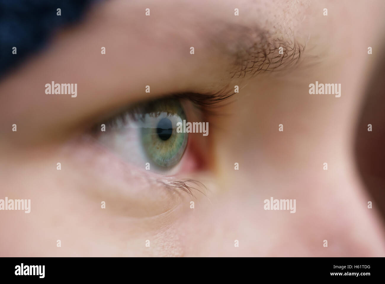 green teen girl eye closeup front view outdoor Stock Photo