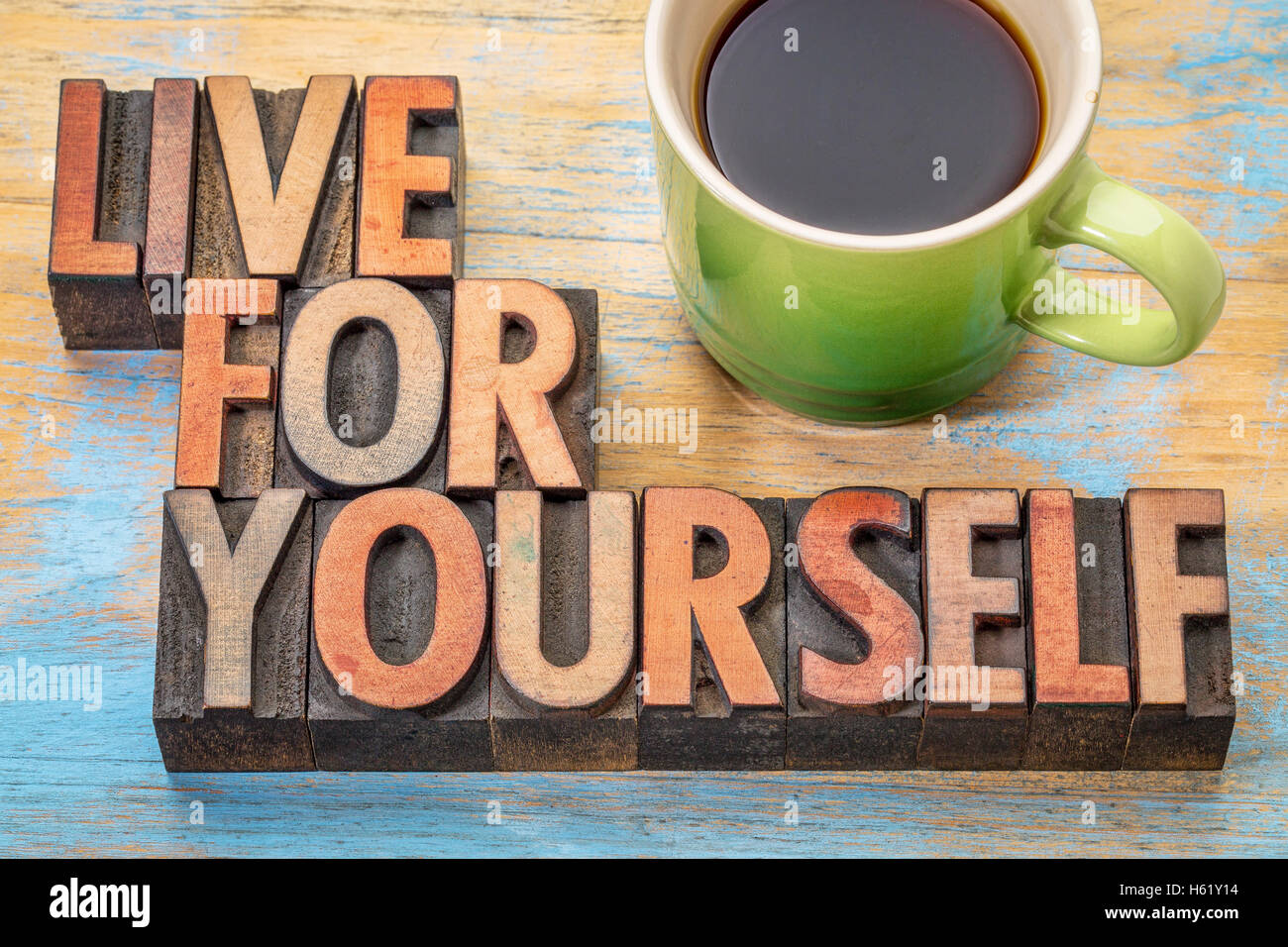 Live for yourself  - word abstract in vintage letterpress wood type with a cup of coffee Stock Photo