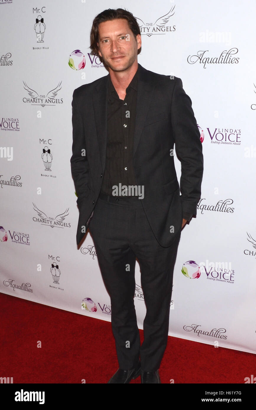 Mike Falkow attends BBQ And Bikinis Benefit hosted by Linda's Voice Foundation Honoring Beverly Johnson at Mr. C Stock Photo