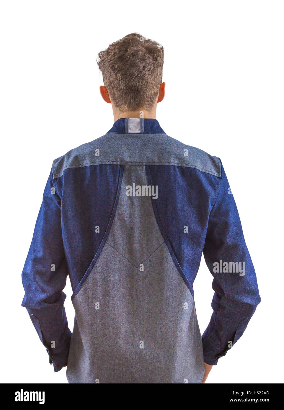Young blond stylish man dressed in mixed blue grey denim shirt, back shot for product catalog catalogue Stock Photo