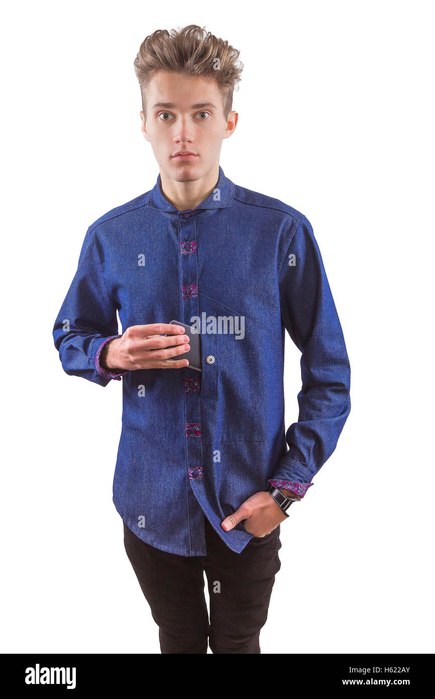 Young blond stylish man dressed in skinny black jeans and denim shirt