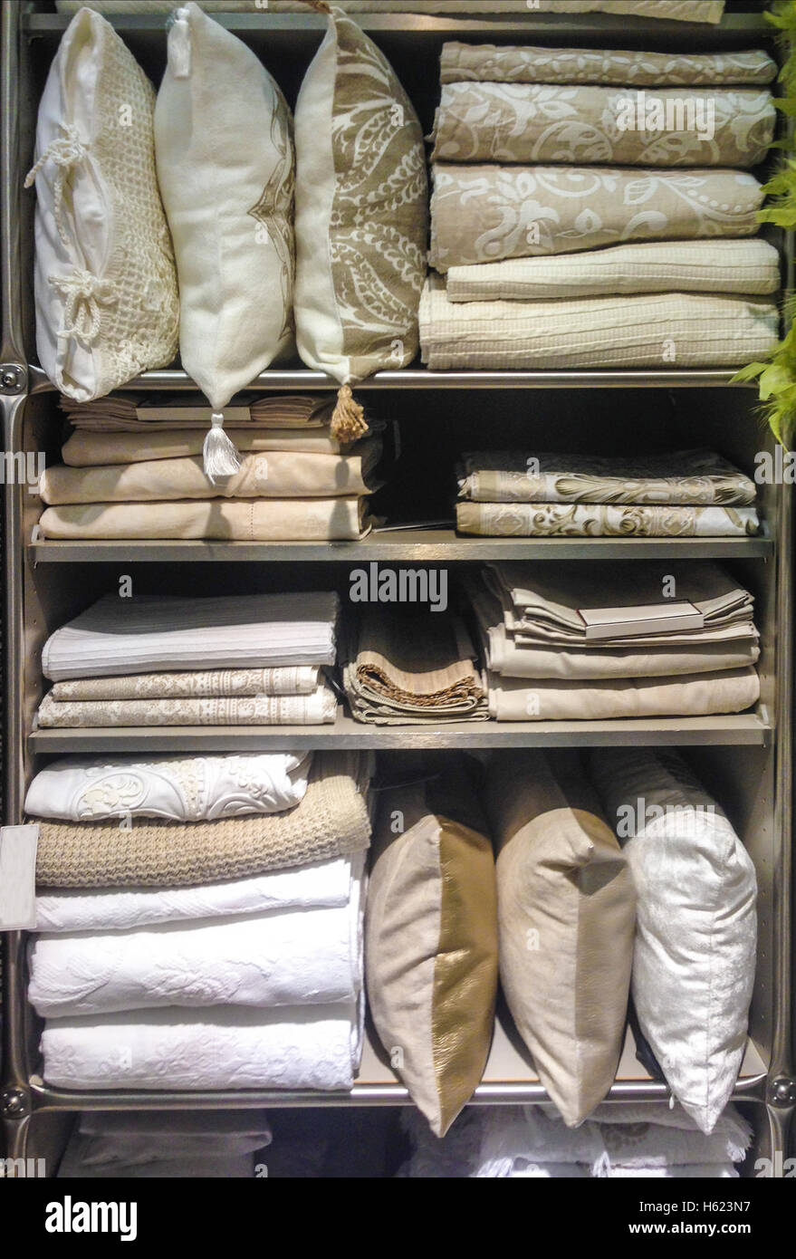 Bright pillows, sheets, bedspreads and bed wear on shelves Stock Photo Alamy