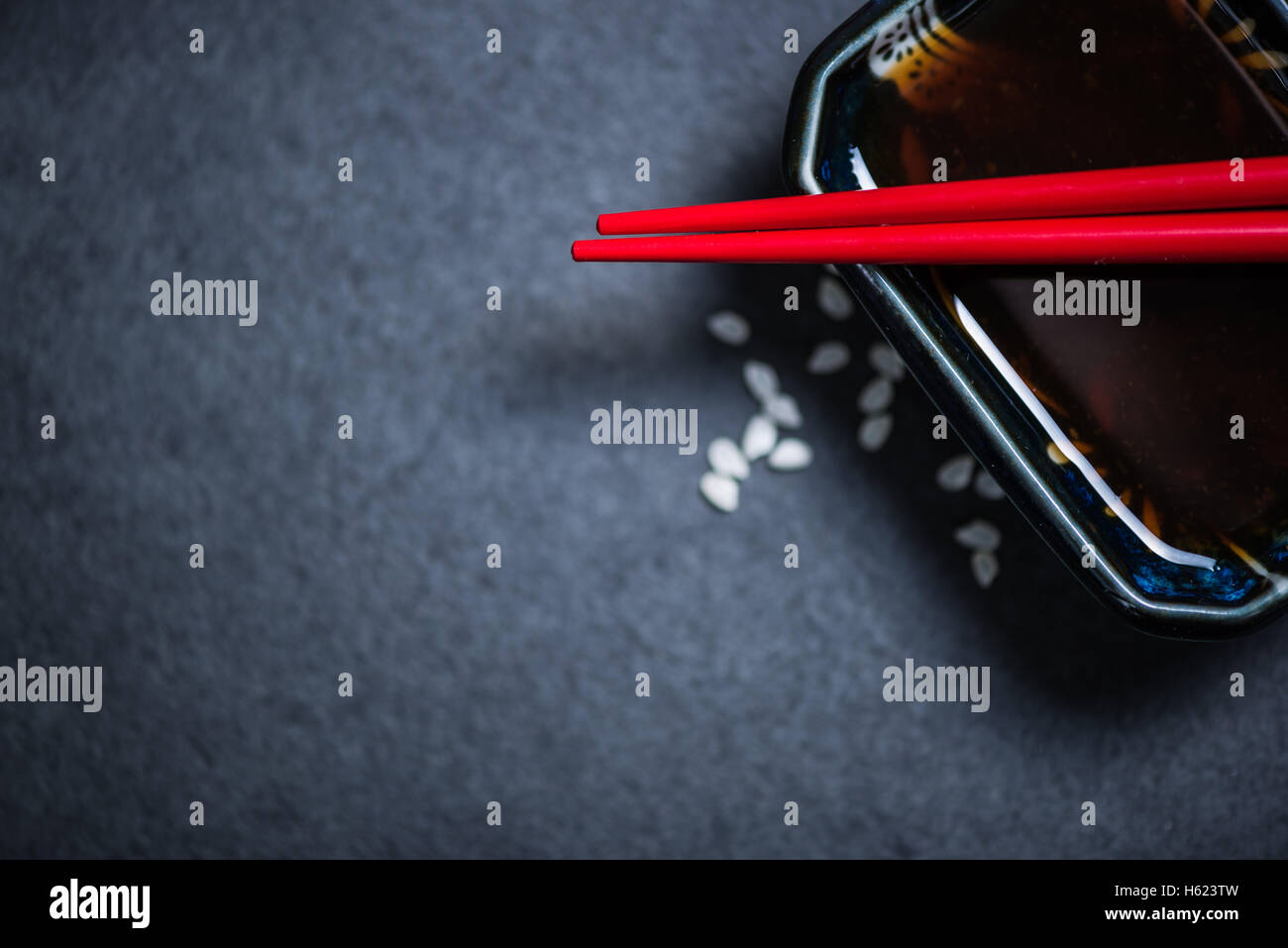Japanese food border background with space for text. Dark slate. Stock Photo