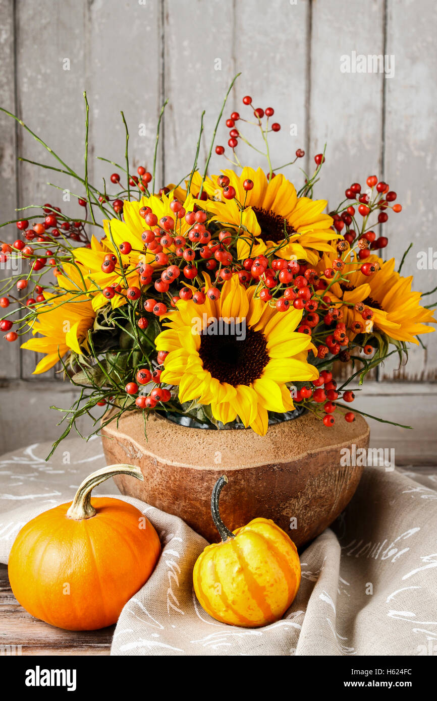 Florist at work how to make floral arrangement with sunflowers and