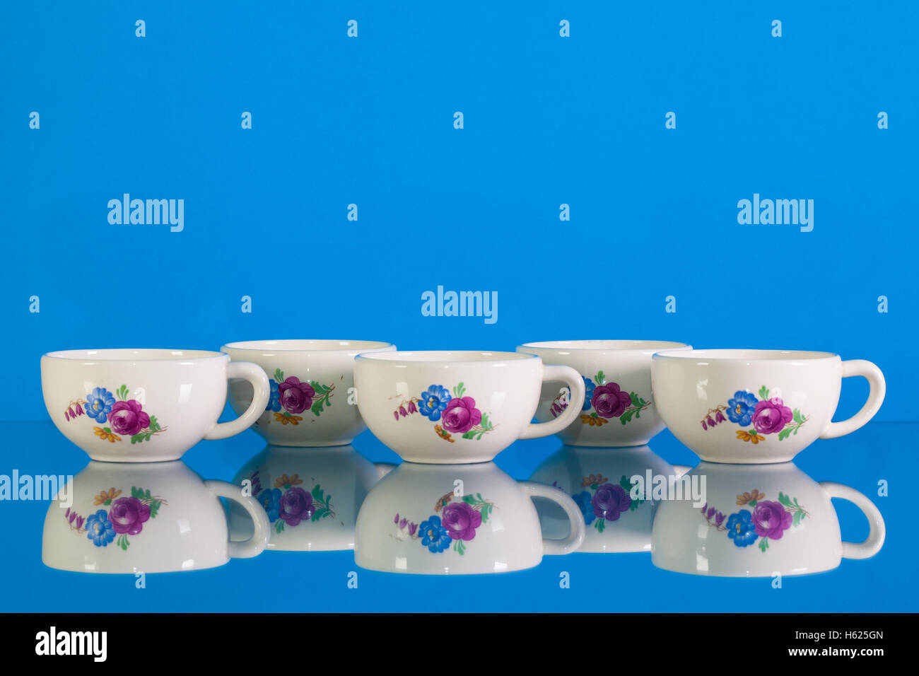 Very old porcelain tea set on blue reflection background Stock Photo ...