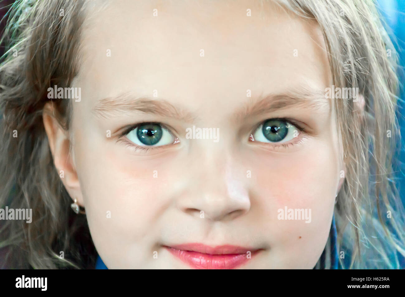 Cute girl with big blue eyes Stock Photo