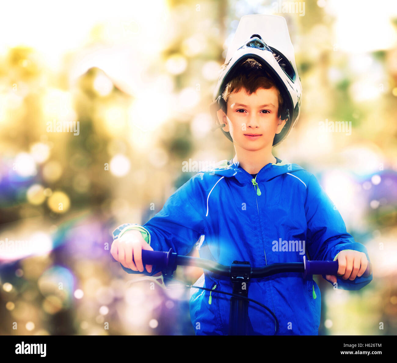 Portrait of boy on a bike Stock Photo