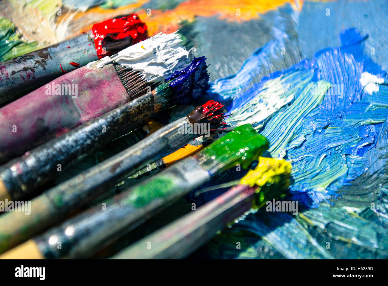 Old palette and brushes Stock Photo