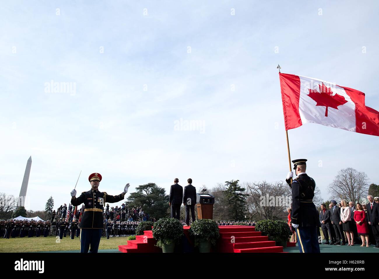 U.S. President Barack Obama and Canadian Prime Minister Justin Trudeau stand on stage during the U.S. national anthem at the State Arrival ceremony on the White House South Lawn March 10, 2016 in Washington, DC. Stock Photo