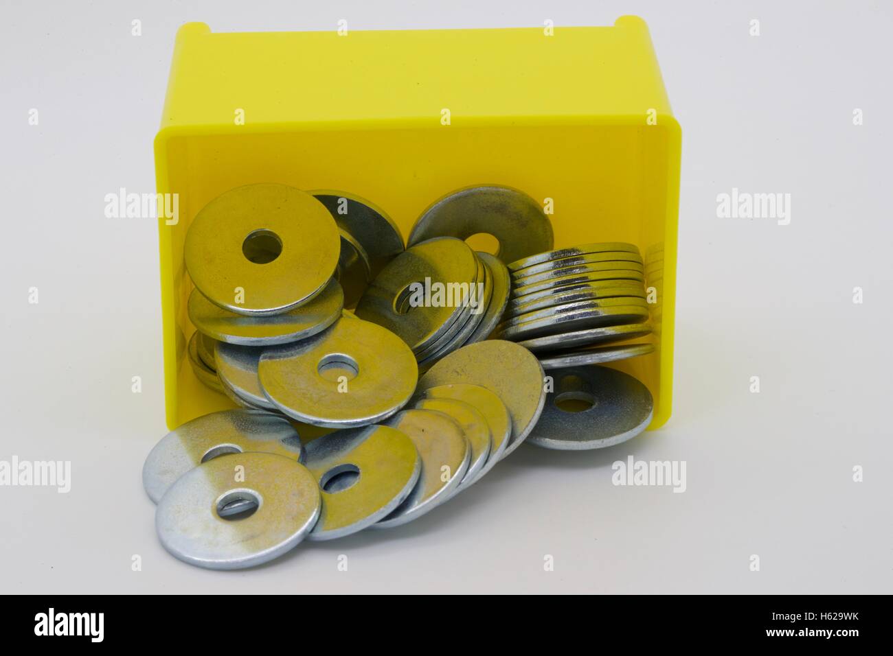Washers in a yellow container. Stock Photo