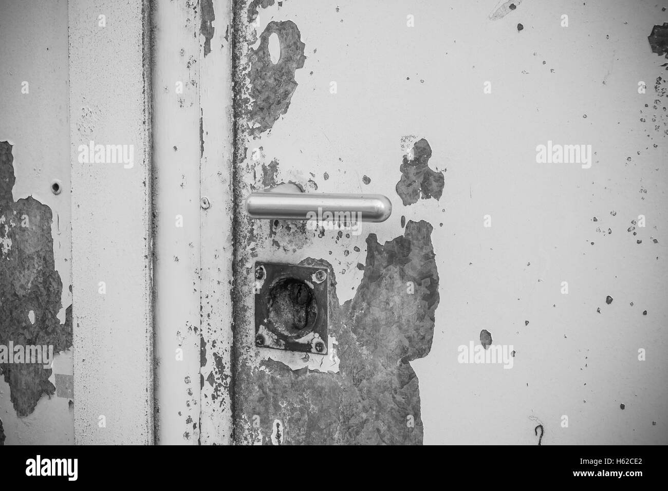 Old lock on a door in metal with old paint Stock Photo