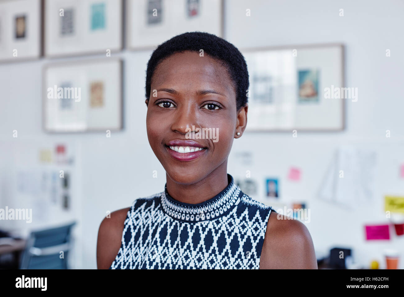 Portrait of smiling woman in office Stock Photo - Alamy