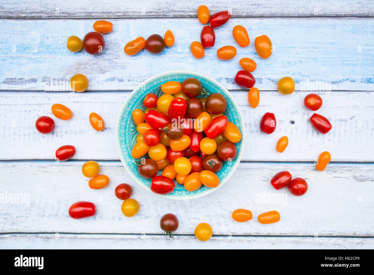 Bowl of yellow and red mini tomatoes Stock Photo - Alamy