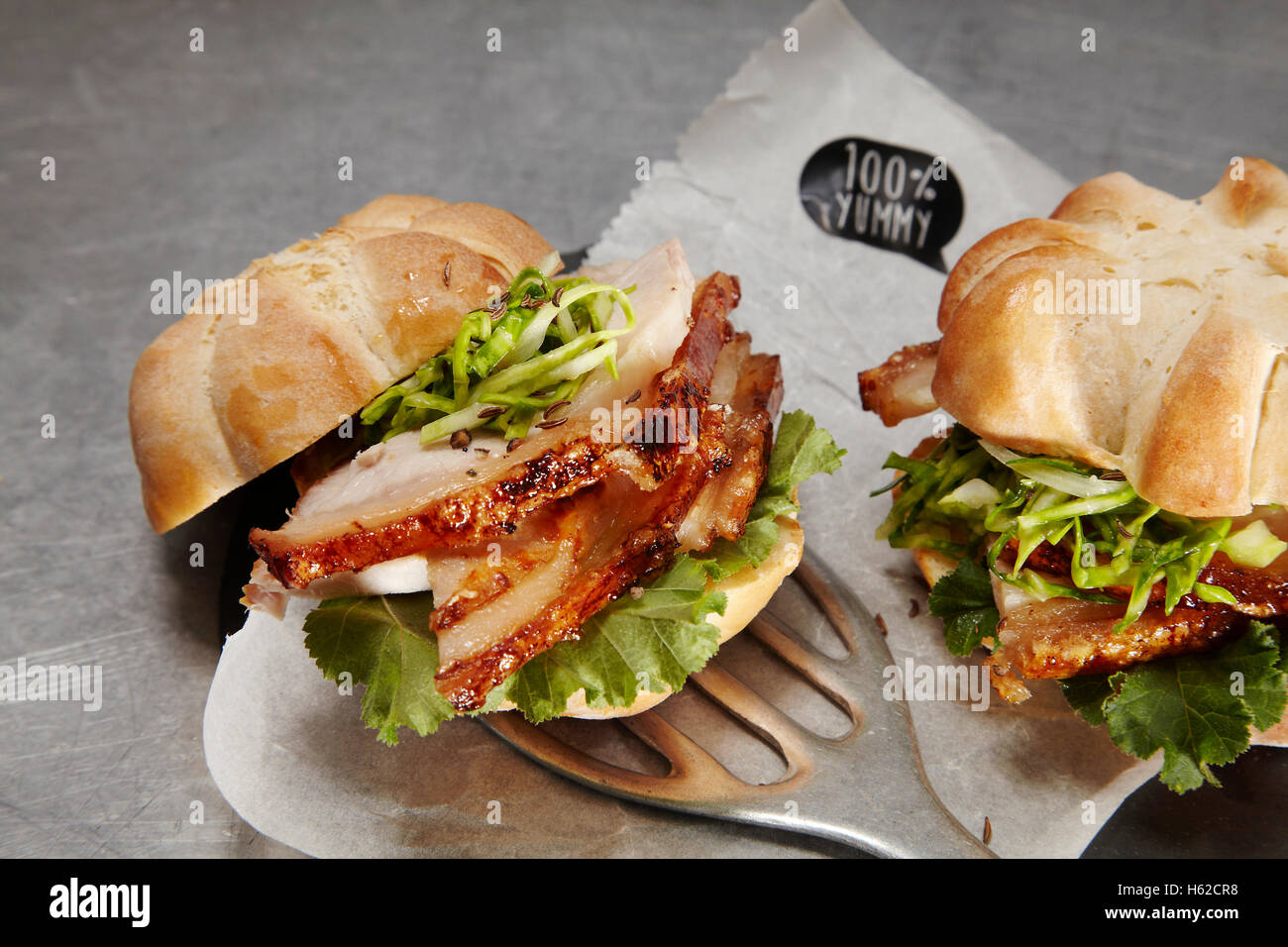 German style burger with pork roast, sweetheart cabbage and mustard sauce Stock Photo