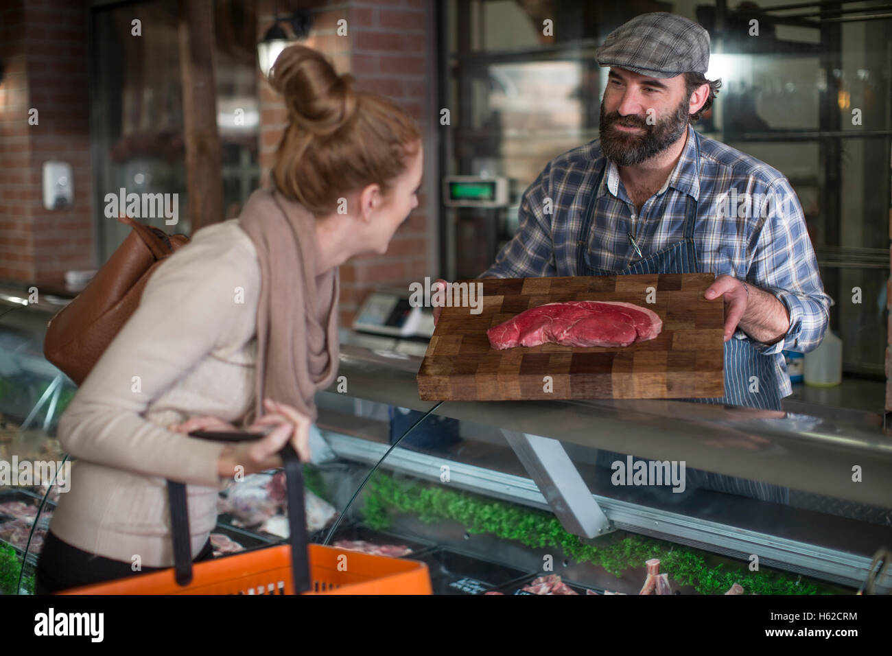 Butcher showing meat customer butchery hi-res stock photography and ...