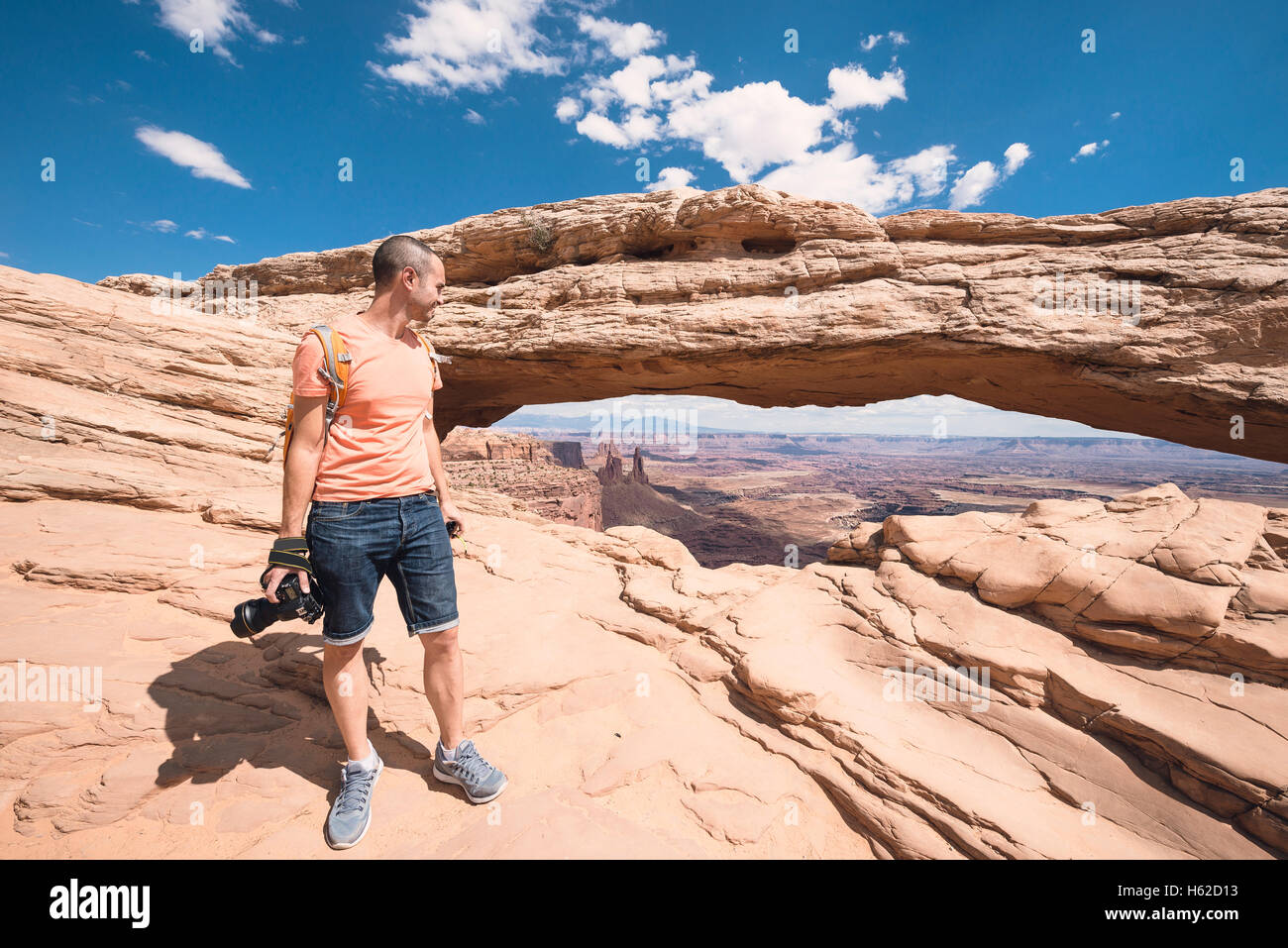 USA, Utah, man in Dead Horse Point with camera Stock Photo
