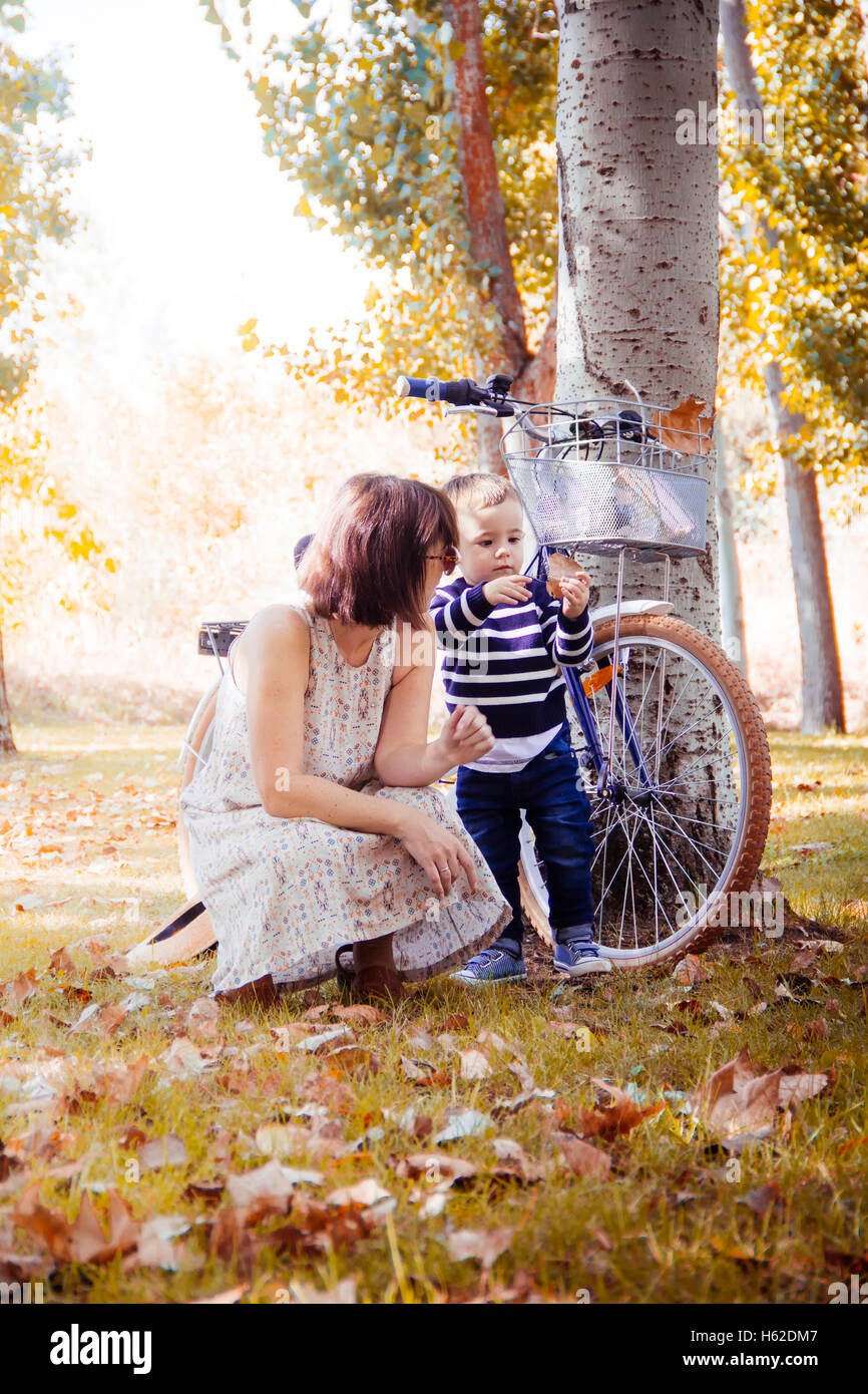 Mother with her little son in autumnal park Stock Photo - Alamy