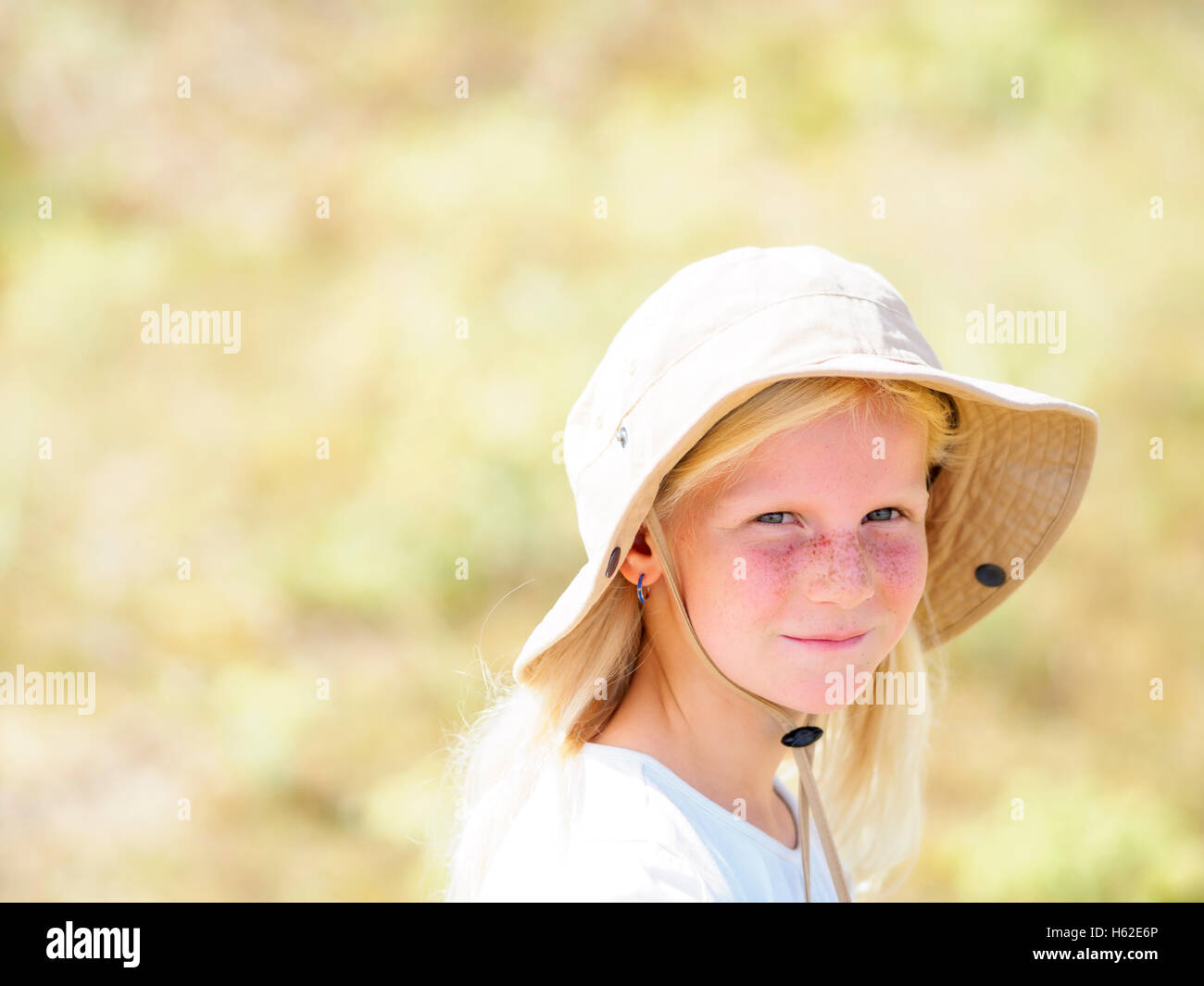 Portrait of a blond girl wearing a floppy hat Stock Photo