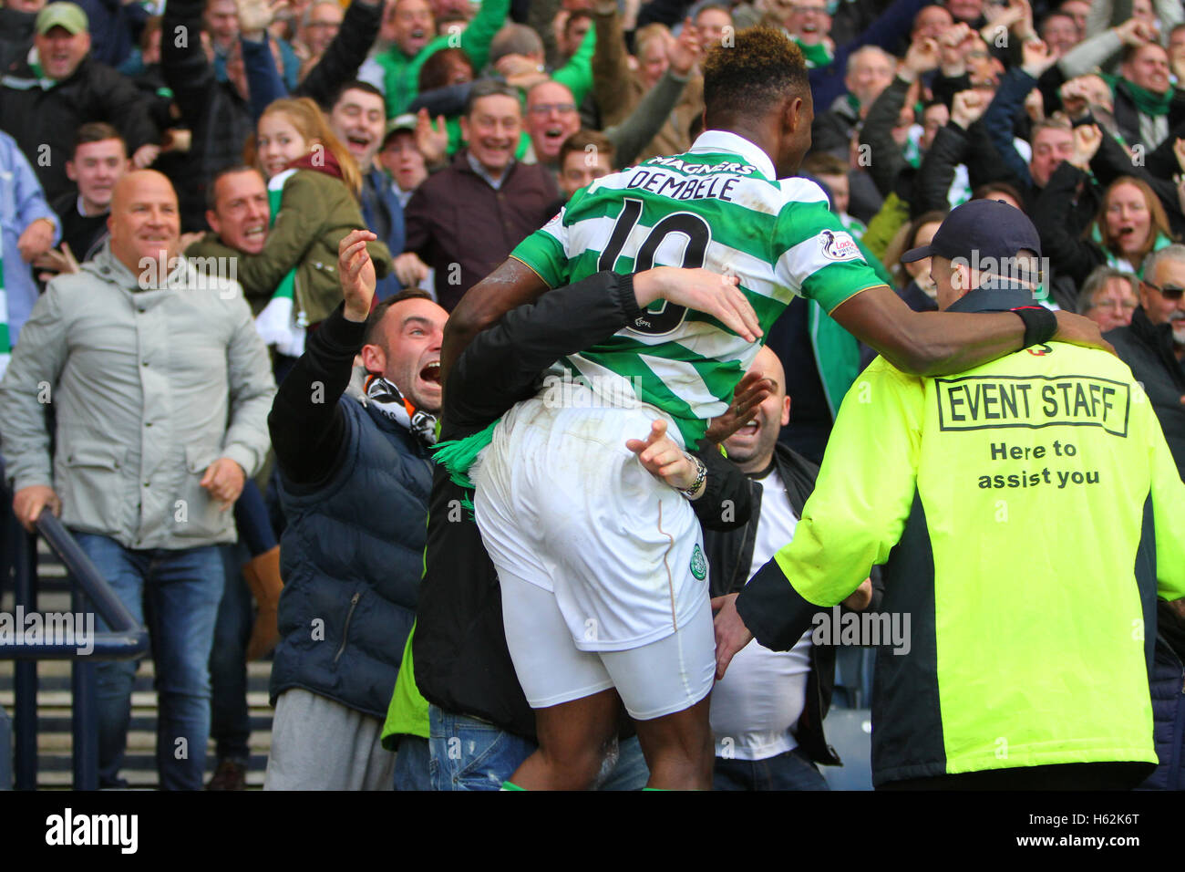 Hampden Park, Glasgow, Scotland. 23rd Oct, 2016. Betfred Cup Semi Final Football. Rangers versus Celtic. Moussa Dembele jumps the barrier to celebrate the goal with the fans Credit:  Action Plus Sports/Alamy Live News Stock Photo