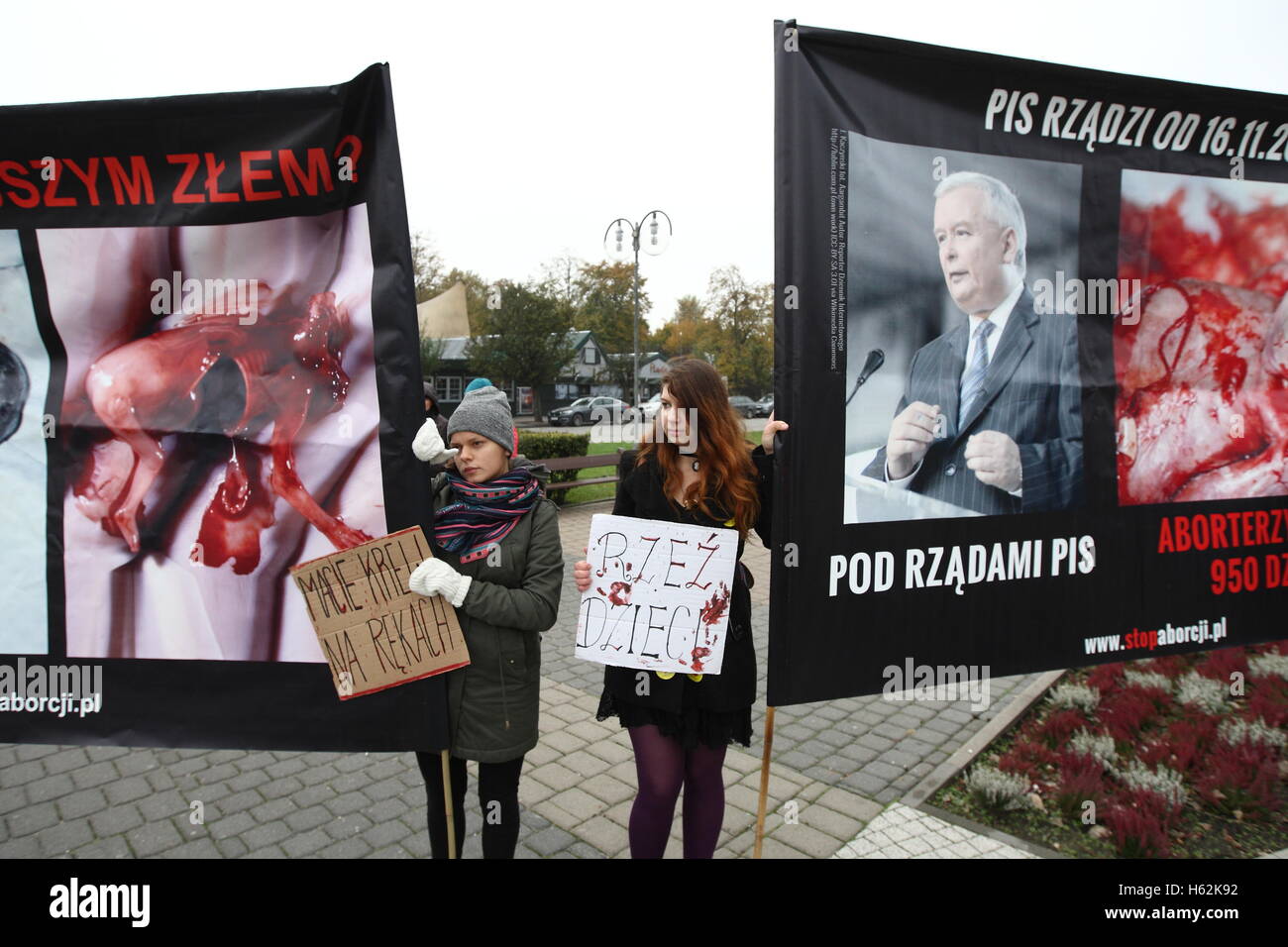 Gdynia, Poland. 23rd Oct, 2016. Pro-life organisation protest in Gdynia. Participants demand full ban on abortion in Poland. They hold banners with dead fetuses, and with portrait of Law and Justice (PiS) party leader Jaroslaw Kaczynski to show that during his reign 950 children were killed (in sense there was 950 legal abortions in Poland during last year). Credit:  Michal Fludra/Alamy Live News Stock Photo