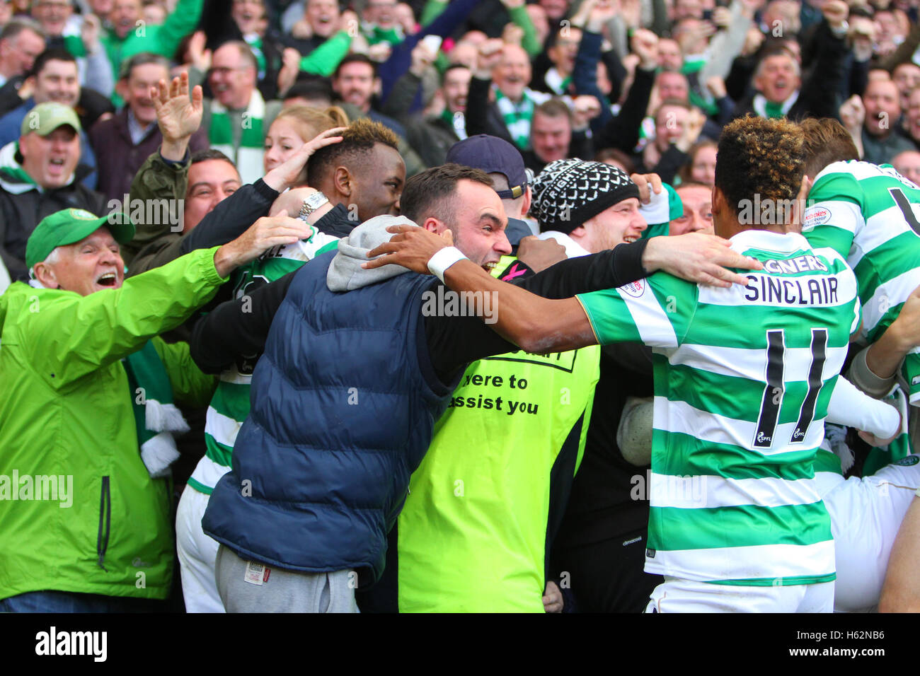 Hampden Park, Glasgow, Scotland. 23rd Oct, 2016. Betfred Cup Semi Final Football. Rangers versus Celtic. Moussa Dembele jumps the barrier to celebrate the goal with the fans Credit:  Action Plus Sports/Alamy Live News Stock Photo