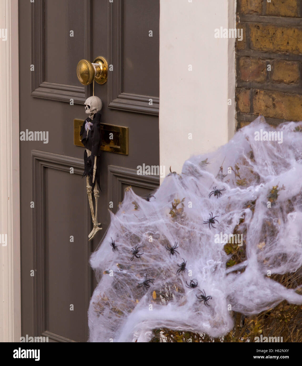 Halloween artifacts and icons displayed on a front door of a home in Chelsea, West London, UK Stock Photo