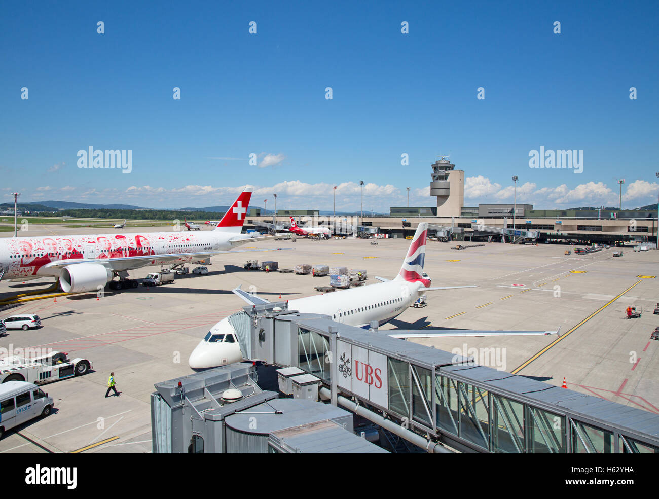 ZURICH - July 30:  Planes preparing for take off at Terminal A of Zurich Airport on July 30, 2016 in Zurich, Switzerland. Zurich Stock Photo