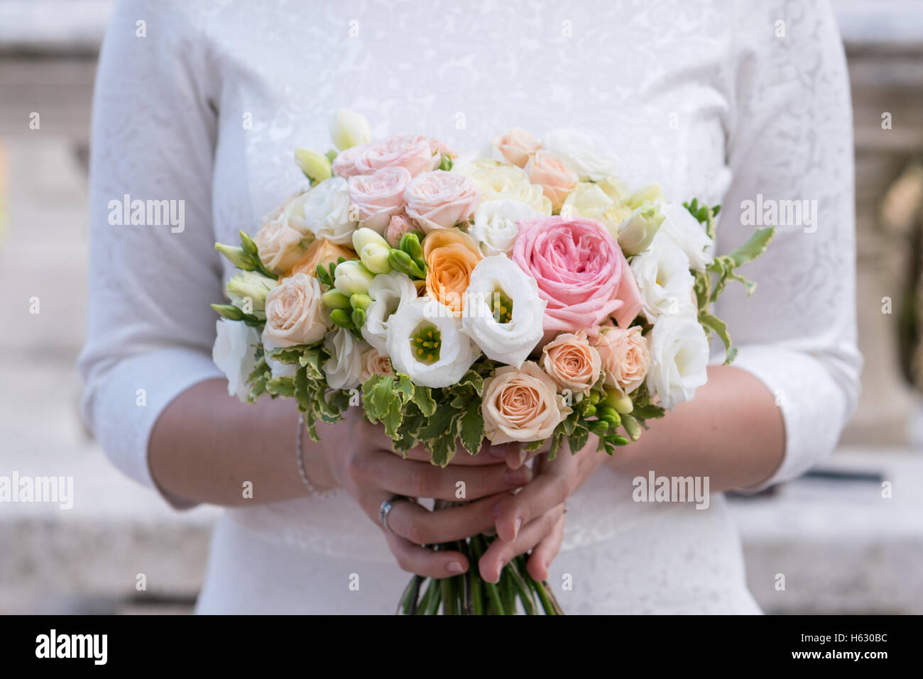 bridal bouquet of roses, freesia, eustoma Stock Photo