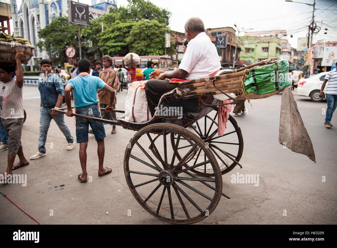 Hand pulling rickshaw puller pulling hires stock photography and images Alamy