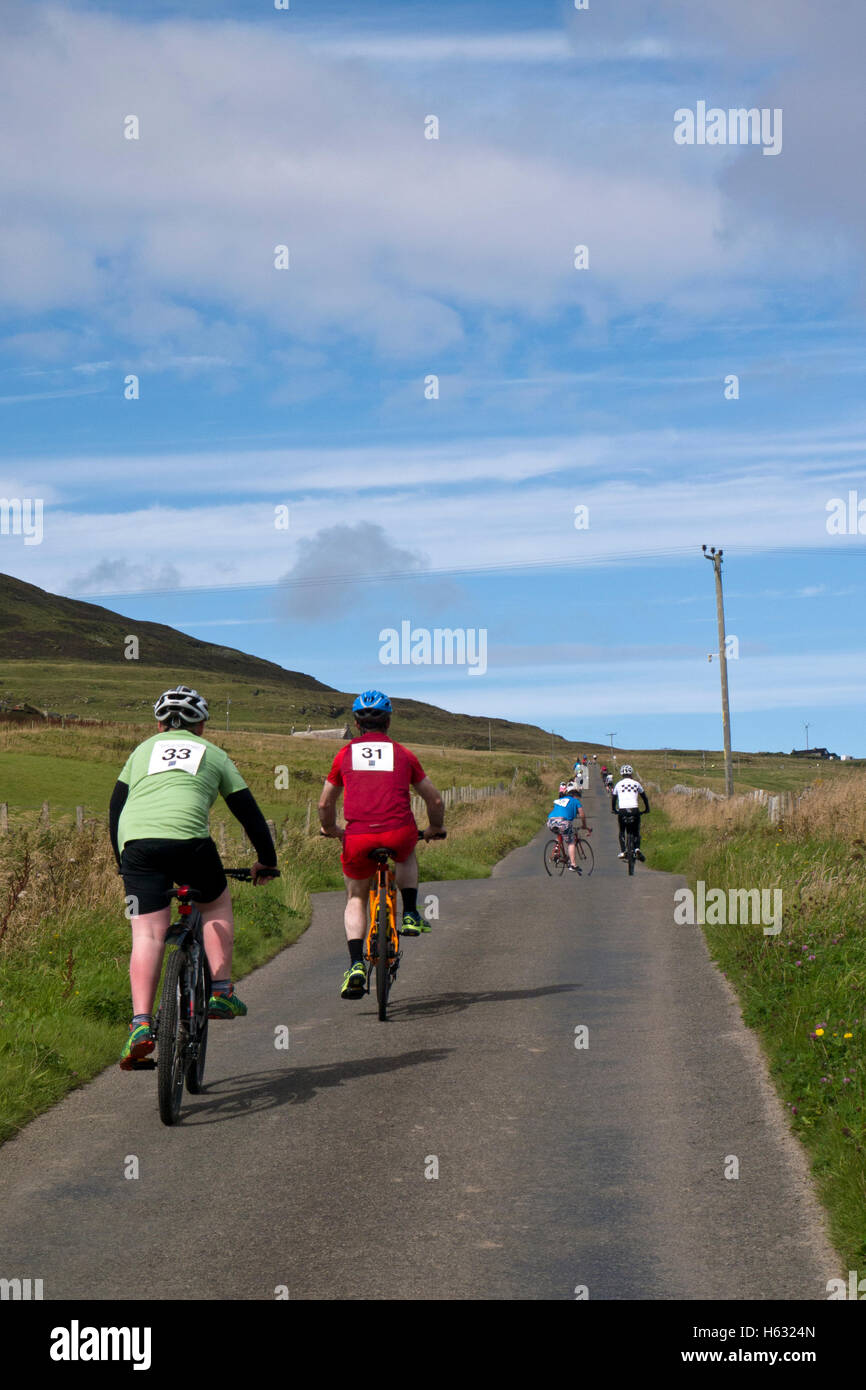 Children cycling uphill in a race Stock Photo Alamy