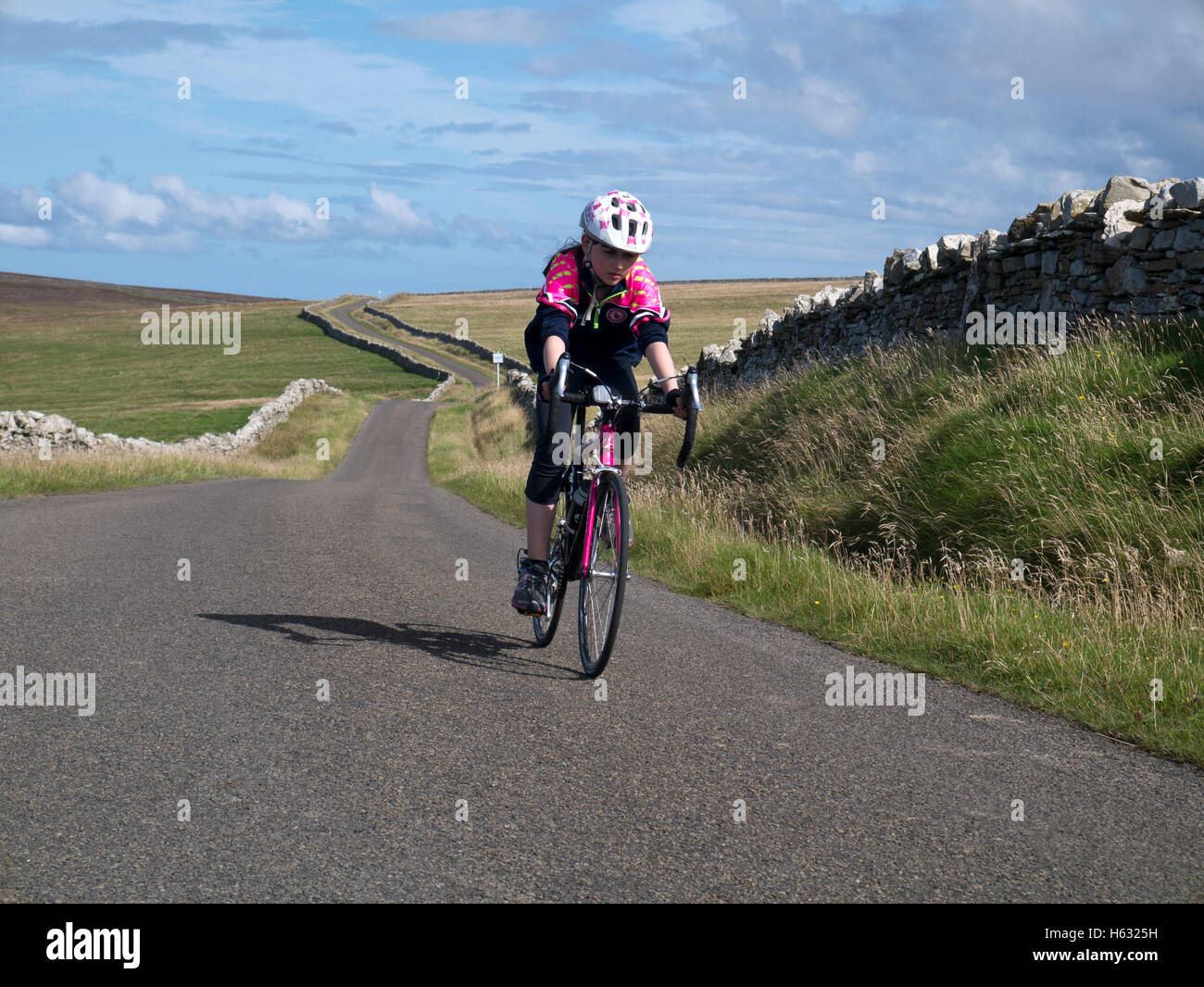 Young girl on racing bike on quiet country roads Stock Photo