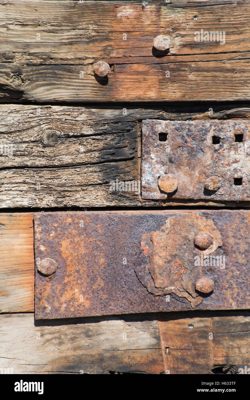 Close-Up of Rusty Nails on Old Board Stock Photo