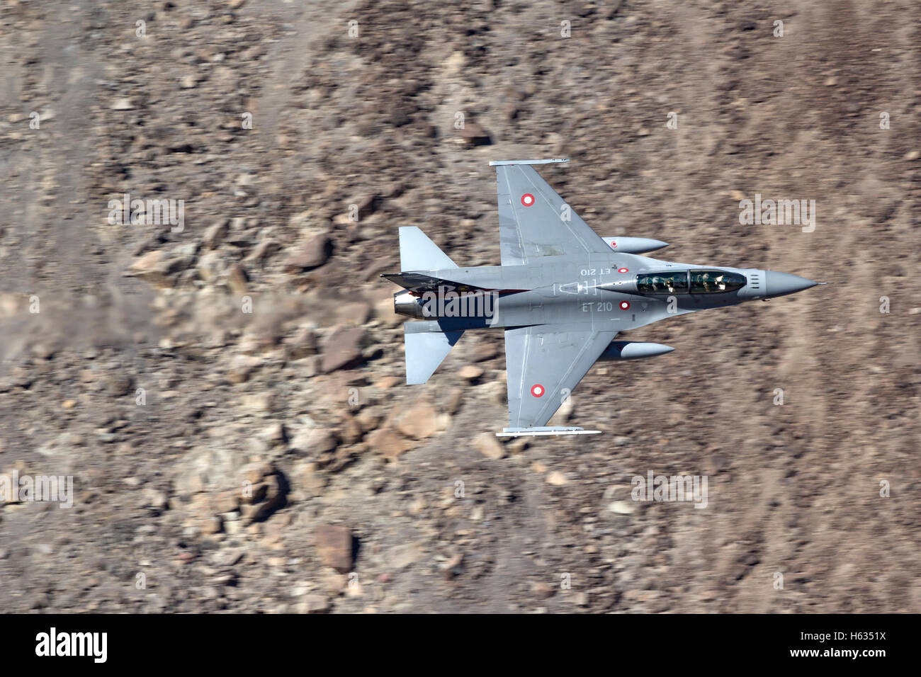 Royal Danish Air Force F-16 in flight over California's Mojave Desert. Stock Photo
