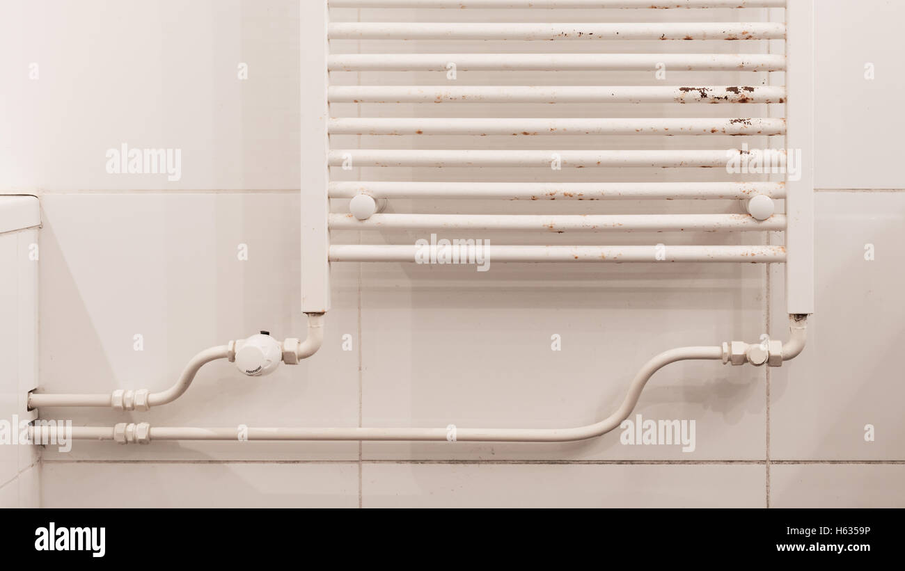 Rusty household cast iron radiator, in need of some TLC Stock Photo - Alamy