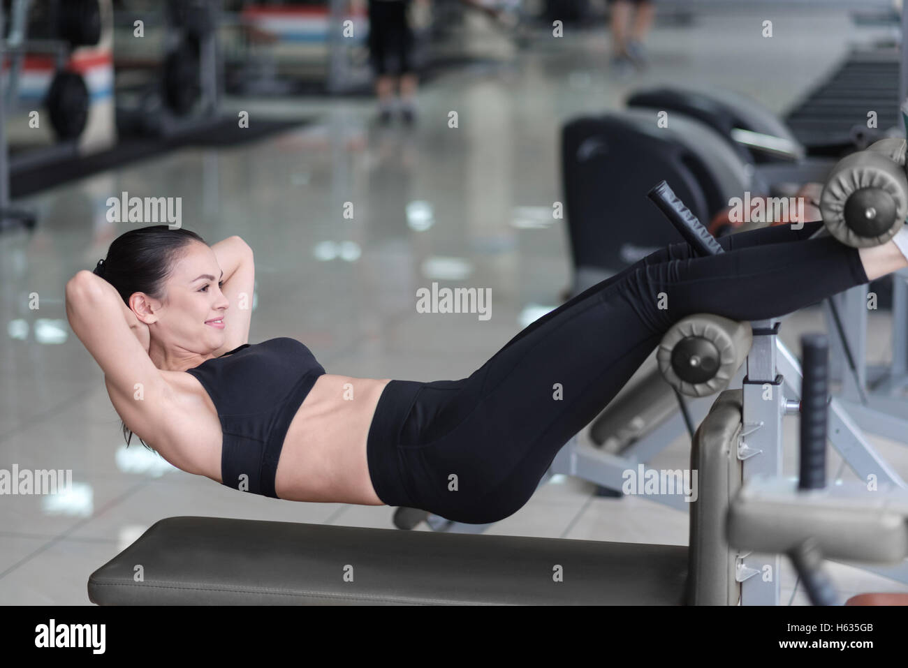 Woman in sportswear doing abs hi-res stock photography and images - Alamy