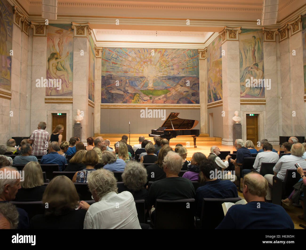 Universitetets Aula, Oslo University Hall in Norway, has three monumental paintings / murals by Edvard Munch, concert audience and 'Solen' - the sun Stock Photo