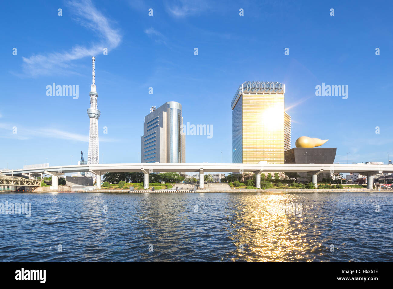 tranquil water with modern buildings near tokyo television tower Stock Photo