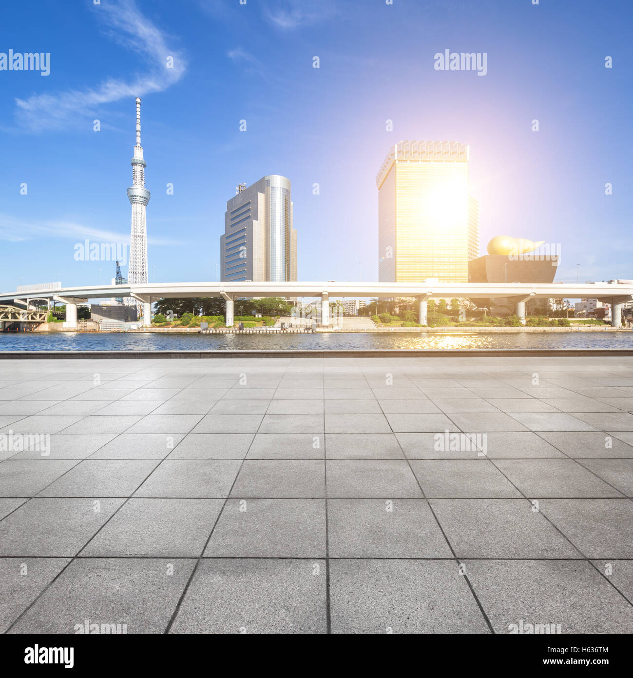 modern office buildings in tokyo with sunbeam on view from empty marble floor Stock Photo