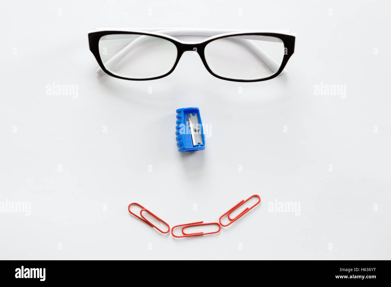 White office desk with a smiling face Stock Photo