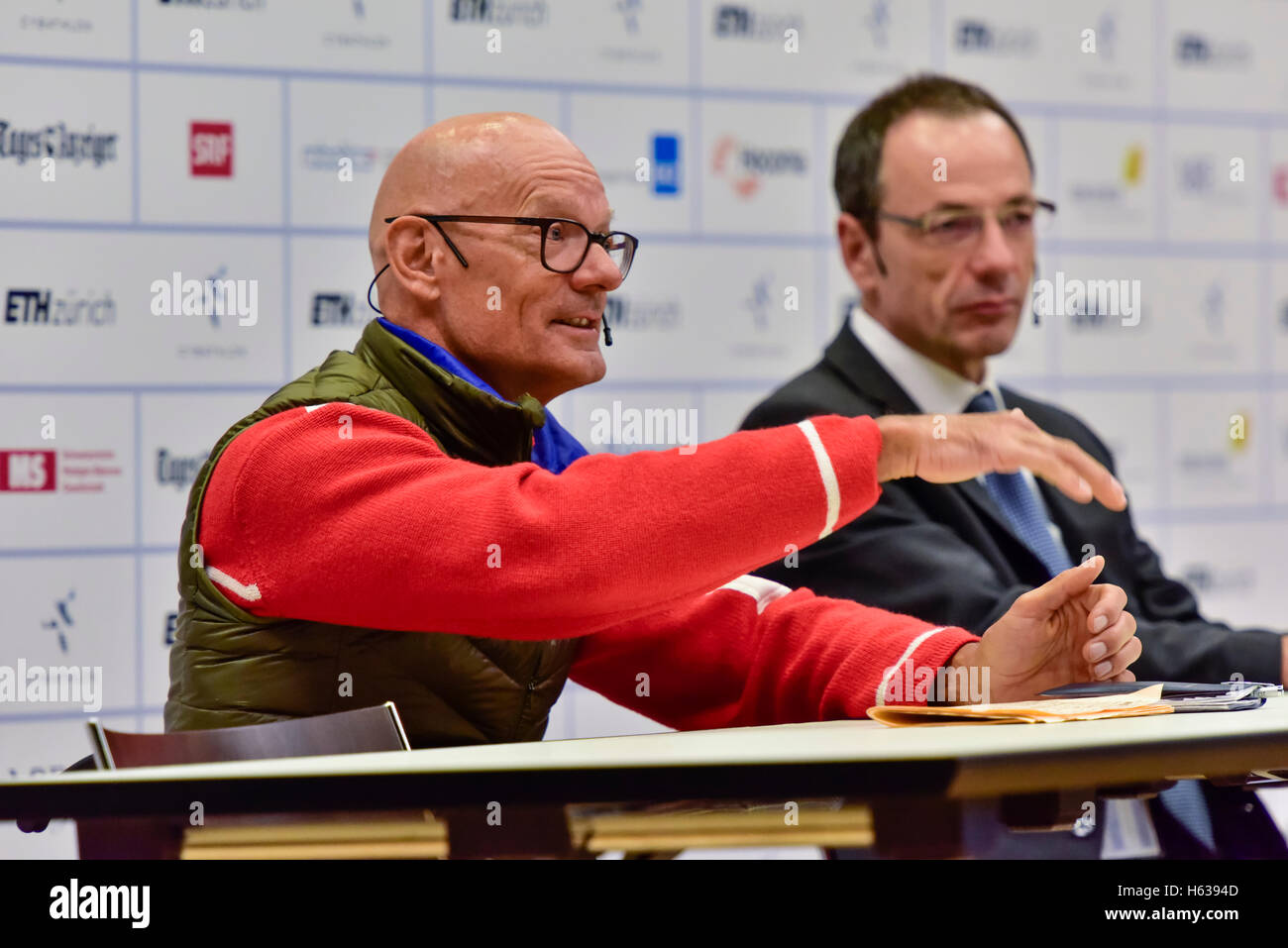 Kloten, Switzerland - 8 October 2016: Heinz Frei (left, Swiss paralympic wheelchair athlete), and Professor Lino Guzella (President of the Swiss Federal Institute of Technology/ETH Zurich) during the opening press conference of Cybathlon, the first championship for racing pilots with disabilities using bionic devices at the Swiss Arena in Kloten (Zurich), Switzerland. Stock Photo
