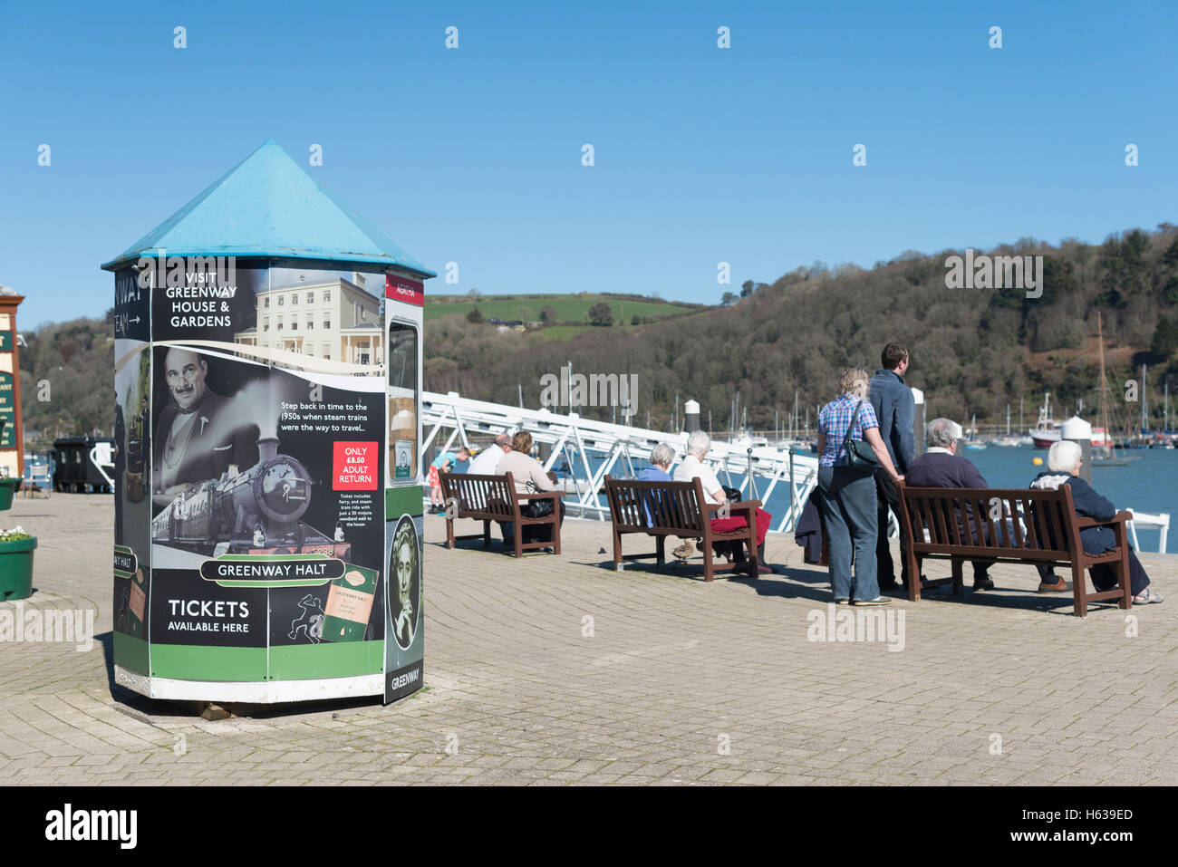 Colourful kiosk advertising trips to Agatha Christie's Devon home, Greenway on the embankment at Dartmouth on the River Dart Stock Photo