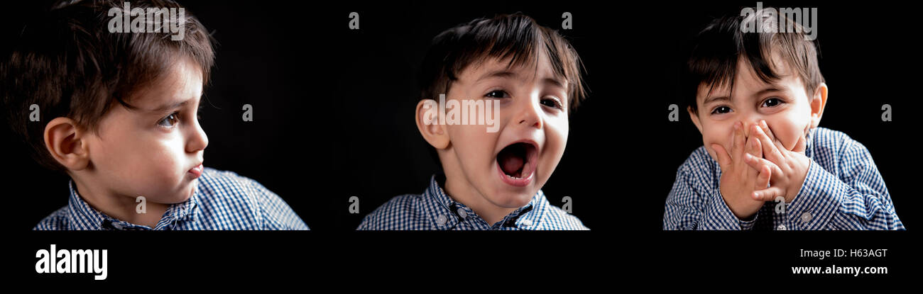 portrait of beautiful European boy on a black background Stock Photo