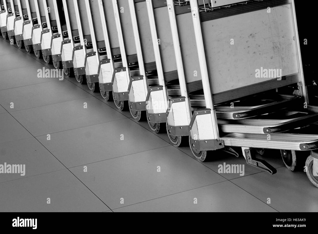 baggage trolleys at airport. Abstract Row of baggage cart in the airport Stock Photo