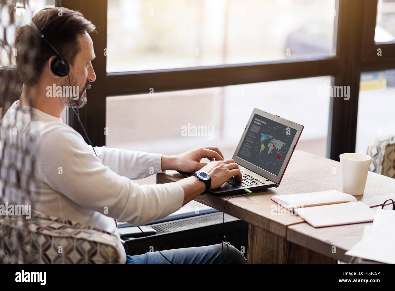 Side view of an using laptop Stock Photo - Alamy