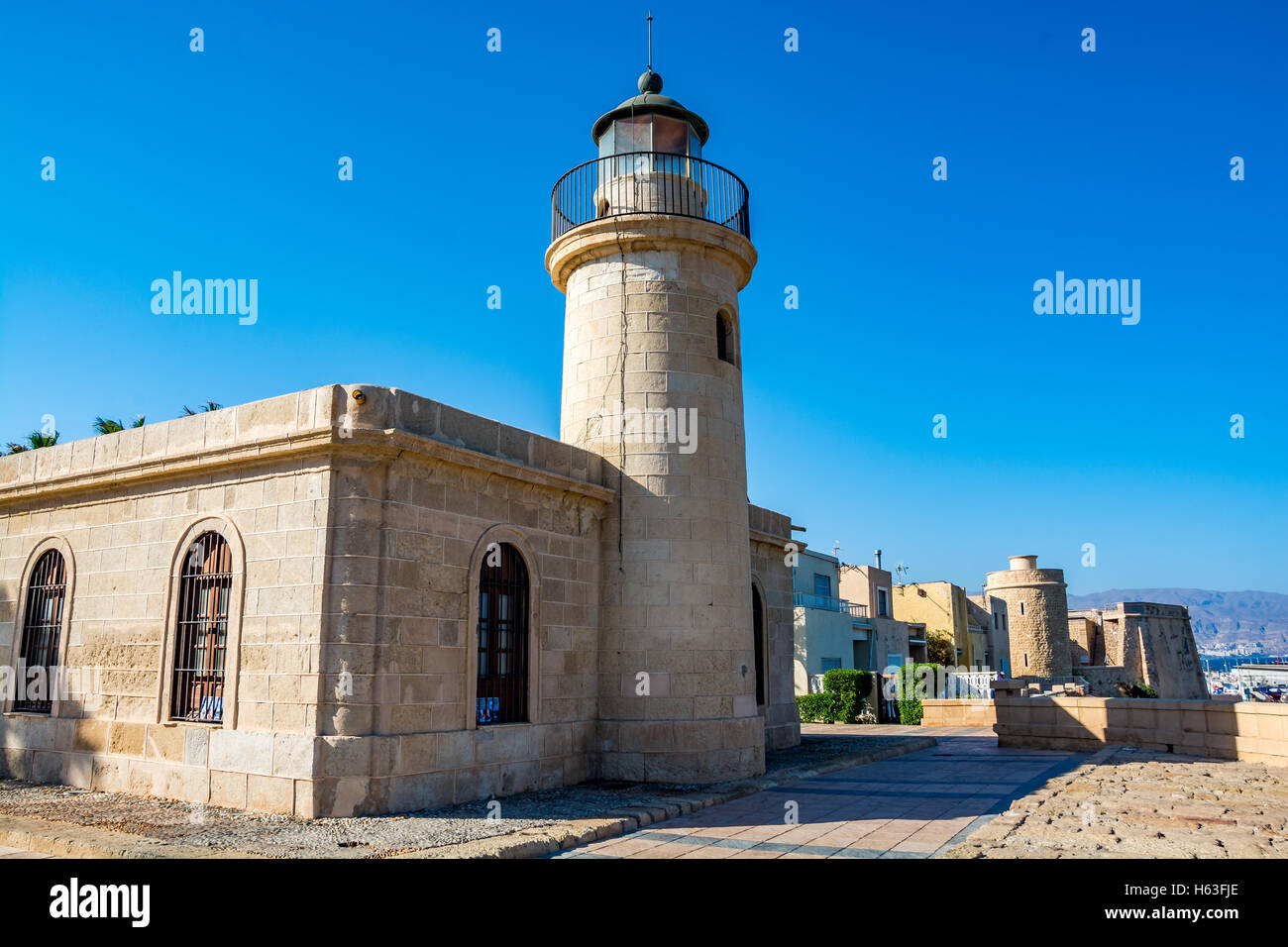 View of the lighthouse and fort in Roquetas de Mar, Almeria region, Costa Tropical, Spain Stock Photo