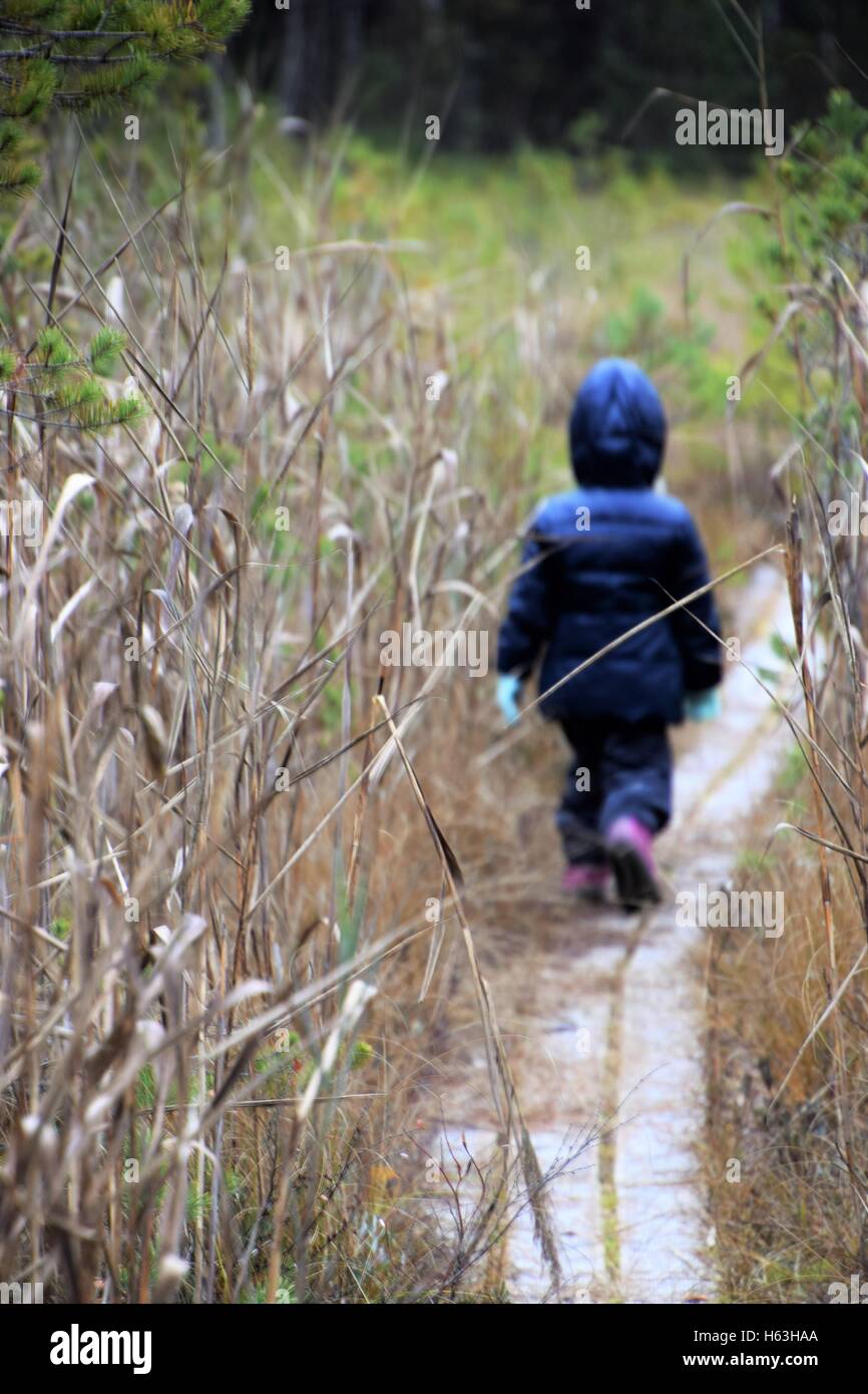 Child walking away back hi-res stock photography and images - Alamy