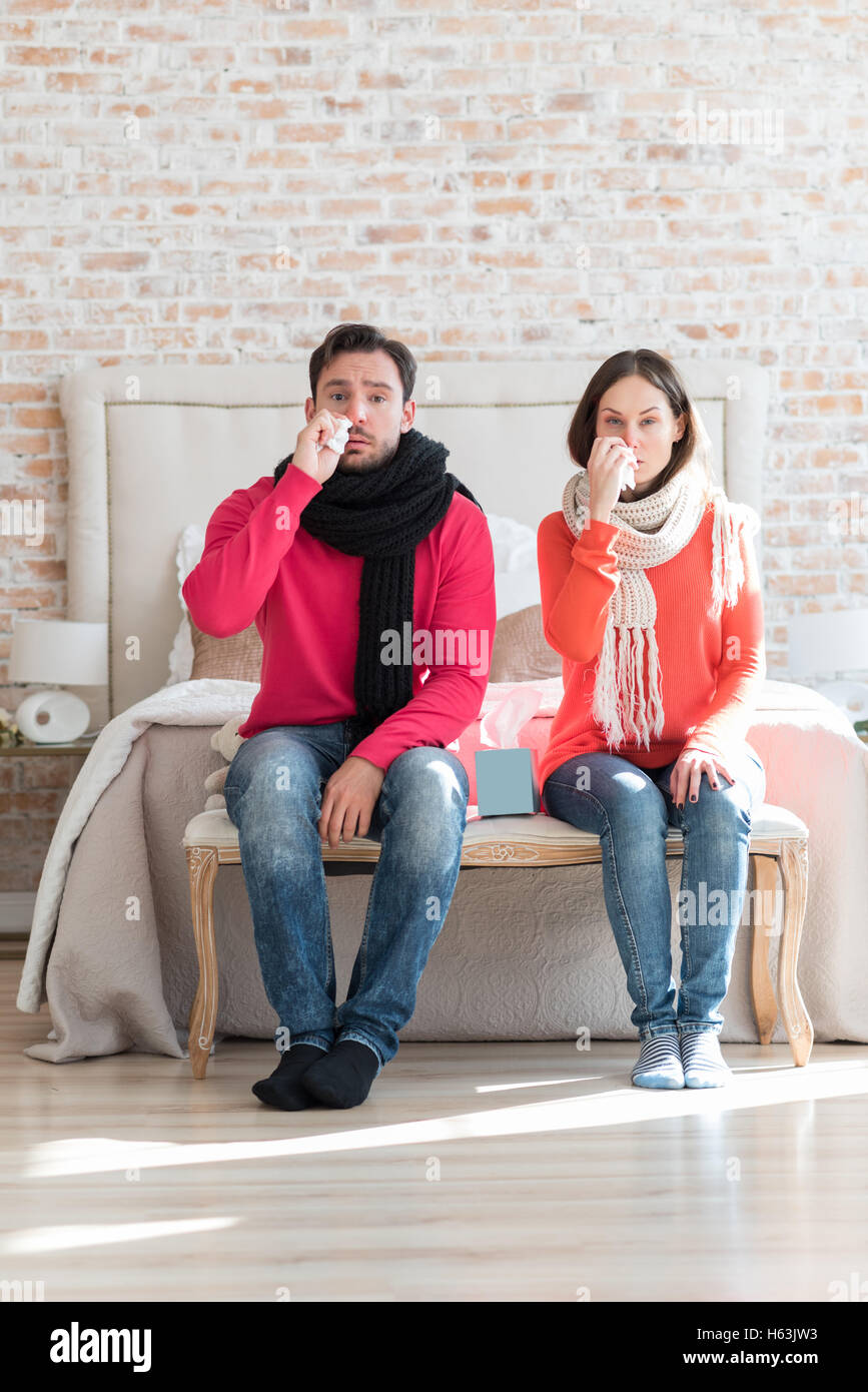 Unhappy sad couple suffering from flu Stock Photo