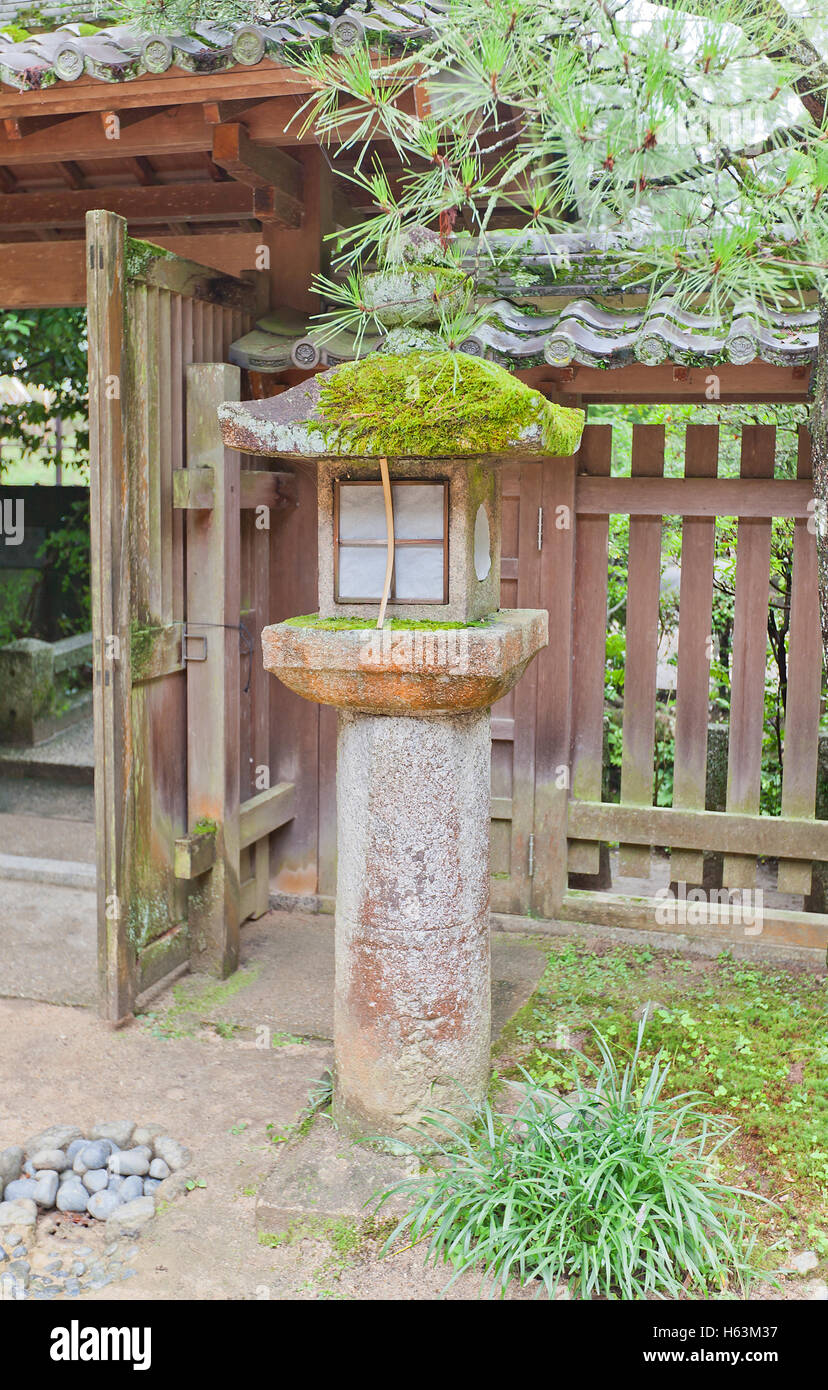 Traditional stone lantern (toro) in Ujigami Shinto Shrine in Uji city near Kyoto Stock Photo